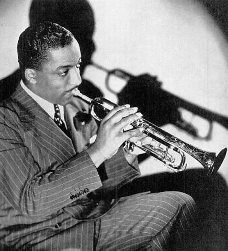 Portrait of a young Erskine Hawkins with his trumpet.